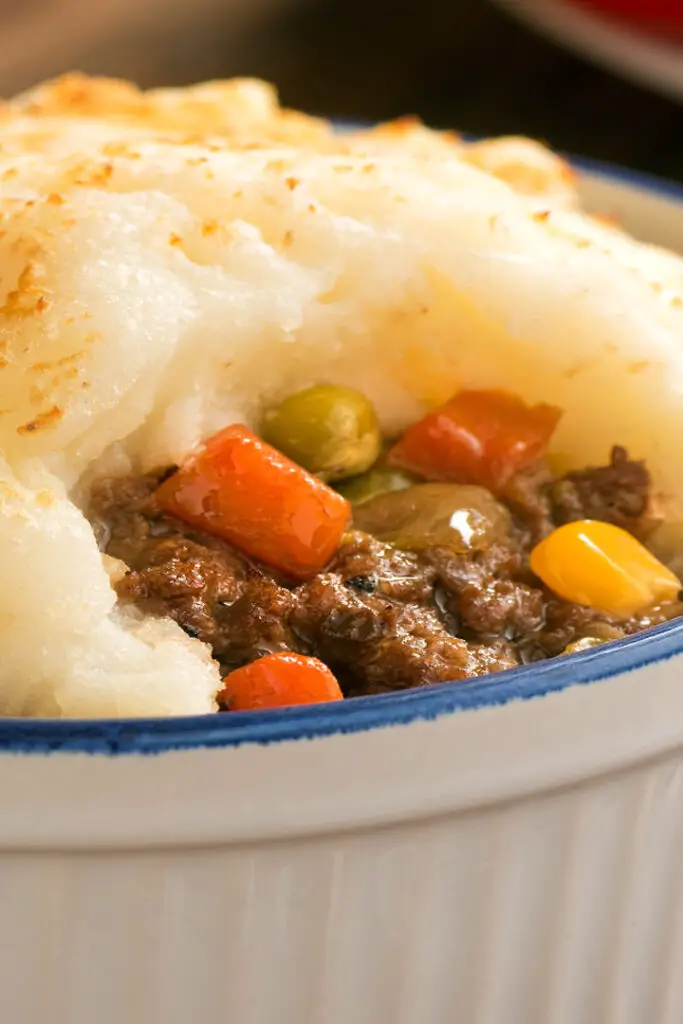 Closeup of Quick Shepherd's Pie in a blue and white bowl.