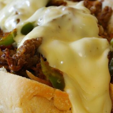 Closeup of Philly Cheesesteak Sandwich with Peppers and Onions.