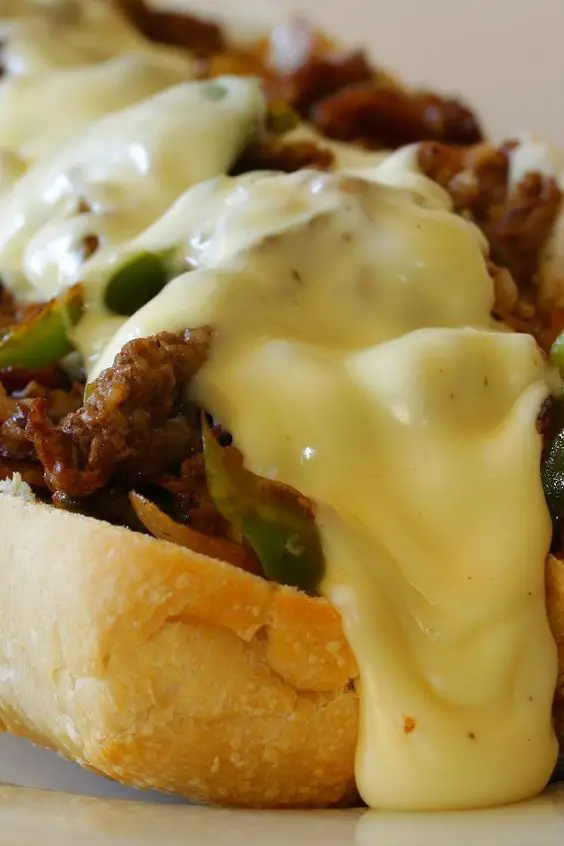 Closeup of Philly Cheesesteak Sandwich with Peppers and Onions.