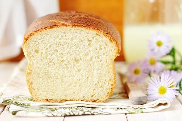 Homemade Amish White Bread with a slice removed. 