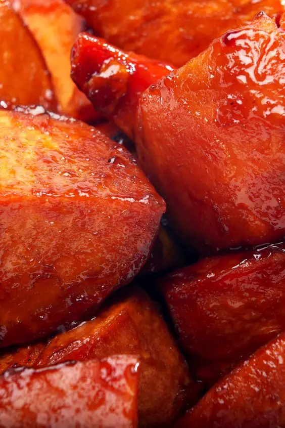 Closeup of Sweet Potatoes coated in maple and brown sugar glaze.