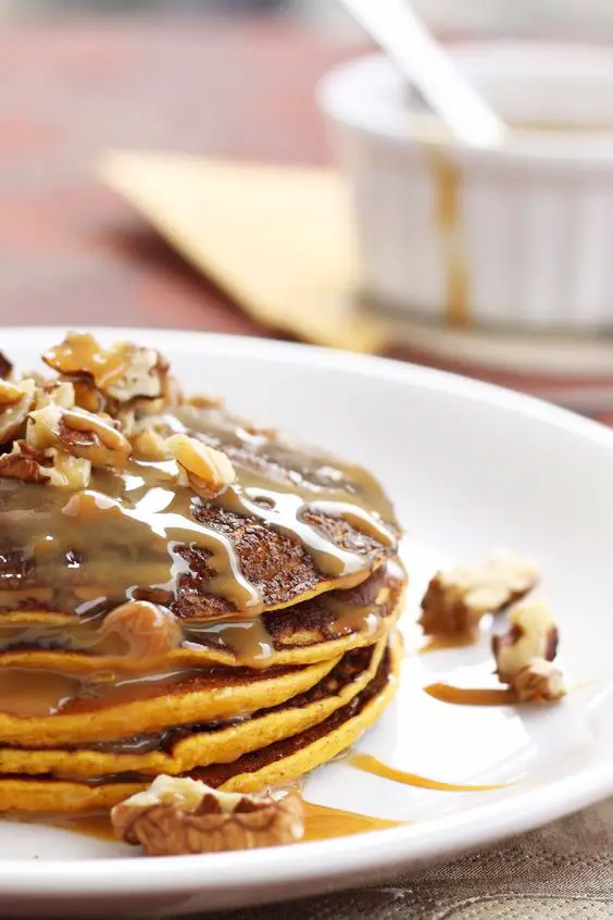 Closeup of Copycat Harvest Grain Nut IHOP Pancakes on a white plate