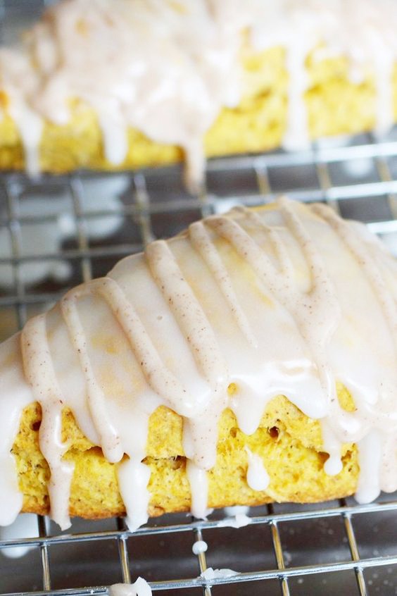 Closeup of Iced Pumpkin Scones on a cooling rack