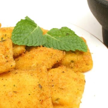 Closeup of Quick and Easy Fried Ravioli on a white plate.