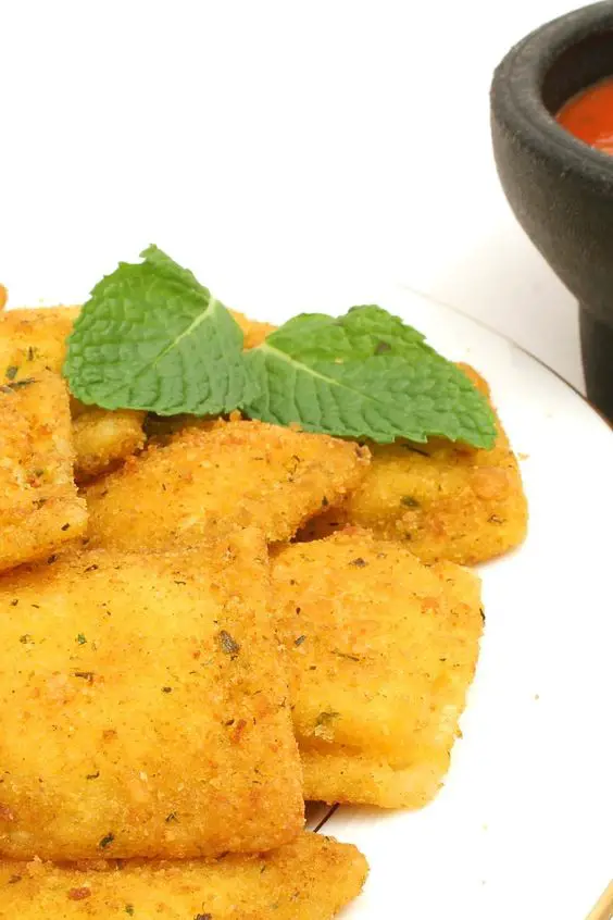 Closeup of Quick and Easy Fried Ravioli on a white plate.