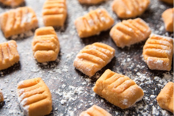 closeup of raw Sweet Potato Gnocchi on a baking sheet