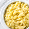 Bowl of Stove-Top Macaroni and Cheese on a wooded background