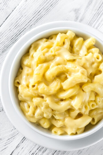Bowl of Stove-Top Macaroni and Cheese on a wooded background