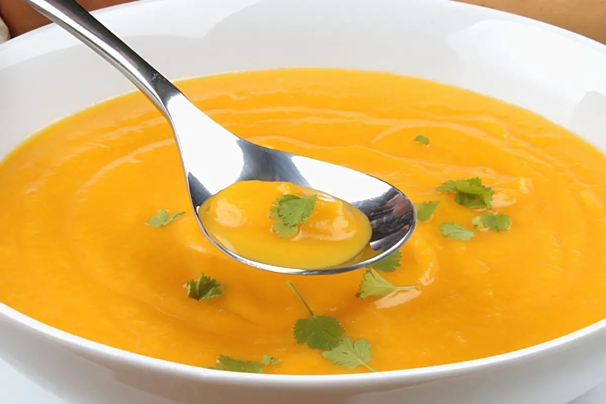 Bowl of Butternut Squash soup in a white bowl.