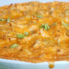 Easy Buffalo Chicken Dip in a shallow, white bowl.