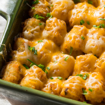 Ground Beef and Tater Tot Casserole in a green casserole dish.