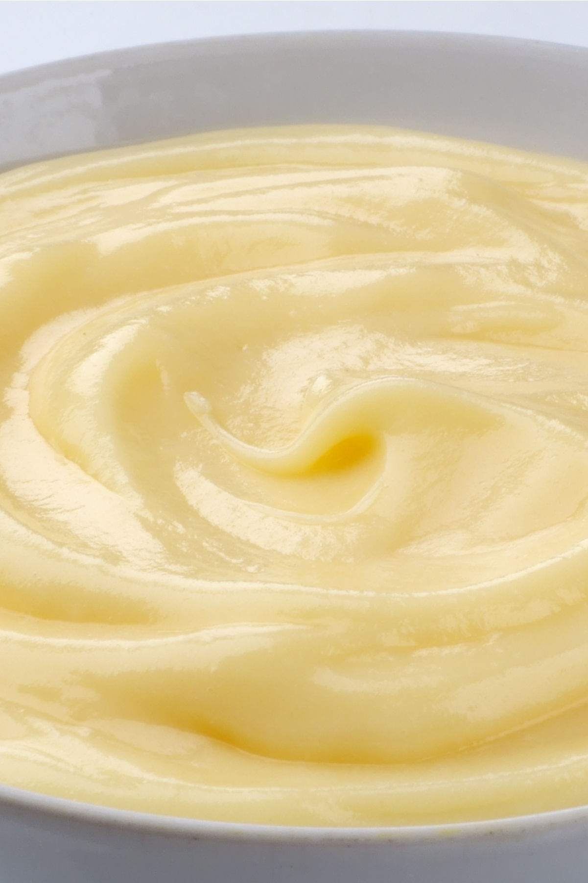 Closeup of Homemade Vanilla Pudding in a white bowl.