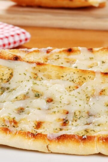 Closeup of 2 pieces of Best Garlic Cheese Bread.