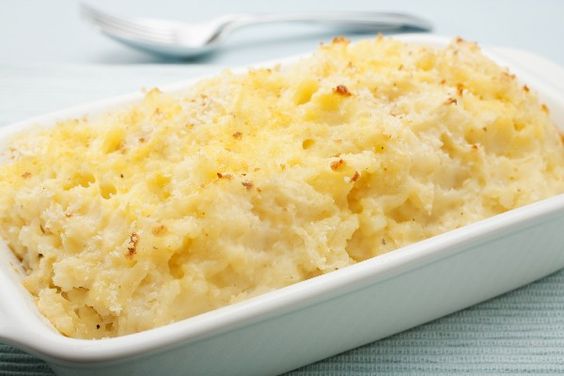Mashed Potatoes with Cream Cheese in a white casserole dish.