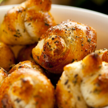 Garlic Knots in a white bowl.