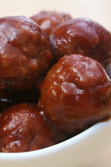 Closeup of Barbecue Meatballs (Simple and Delicious) in a white bowl.