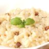 Closeup of Bacon and Parmesan Risotto in a white bowl.