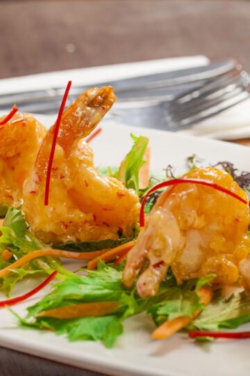 Delicious Copycat Bang Bang Shrimp (Bonefish Grill) on a white plate.