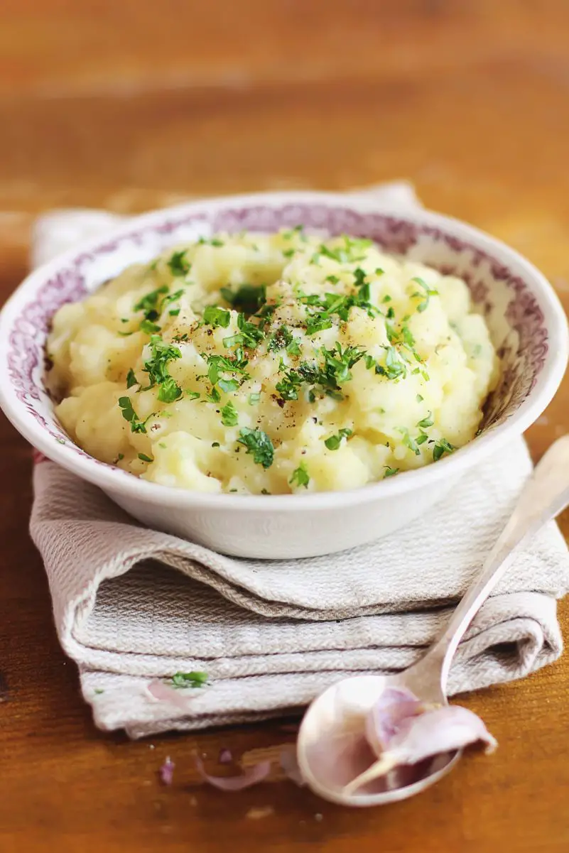 Cheesy Ranch Mashed Potatoes: in a white bowl sitting on top of a white cloth napkin.