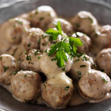 Copycat Ikea Meatballs in a dark brown bowl.