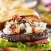 Closeup of Bacon Cheeseburgers with Blue Cheese.