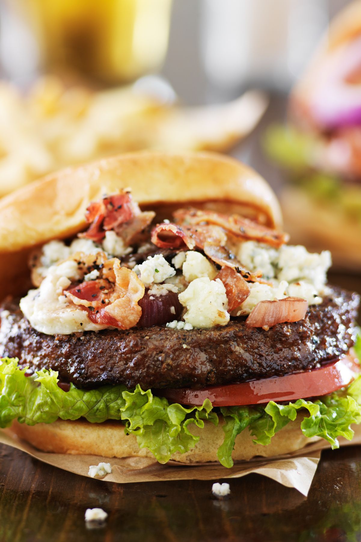 Closeup of Bacon Cheeseburgers with Blue Cheese.