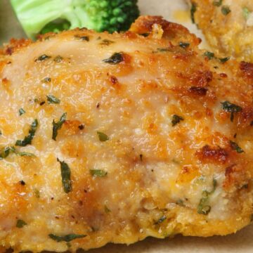 closeup of Baked Garlic Cheddar Chicken on a white plate.