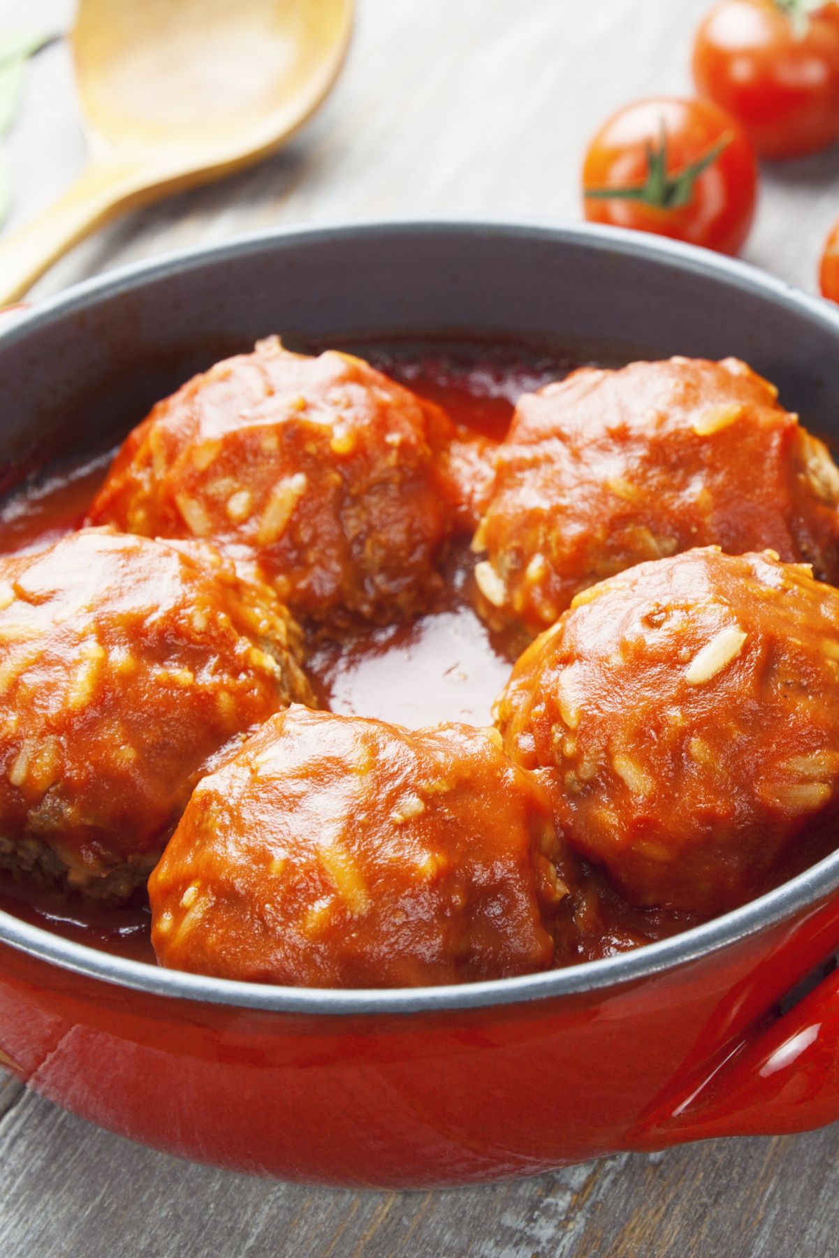 Closeup of Easy Porcupine Meatballs in a red pan.