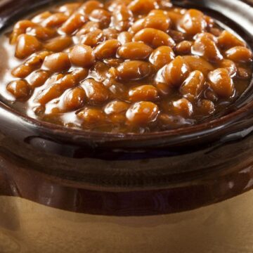 Closeup of Homemade Boston Baked Beans in a brown crock.