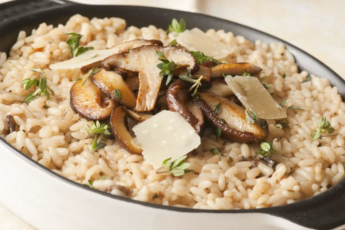 Homemade Italian Mushroom Risotto in a white and black pan.