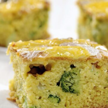 Closeup of Simple Cheddar and Broccoli Cornbread on a white background.