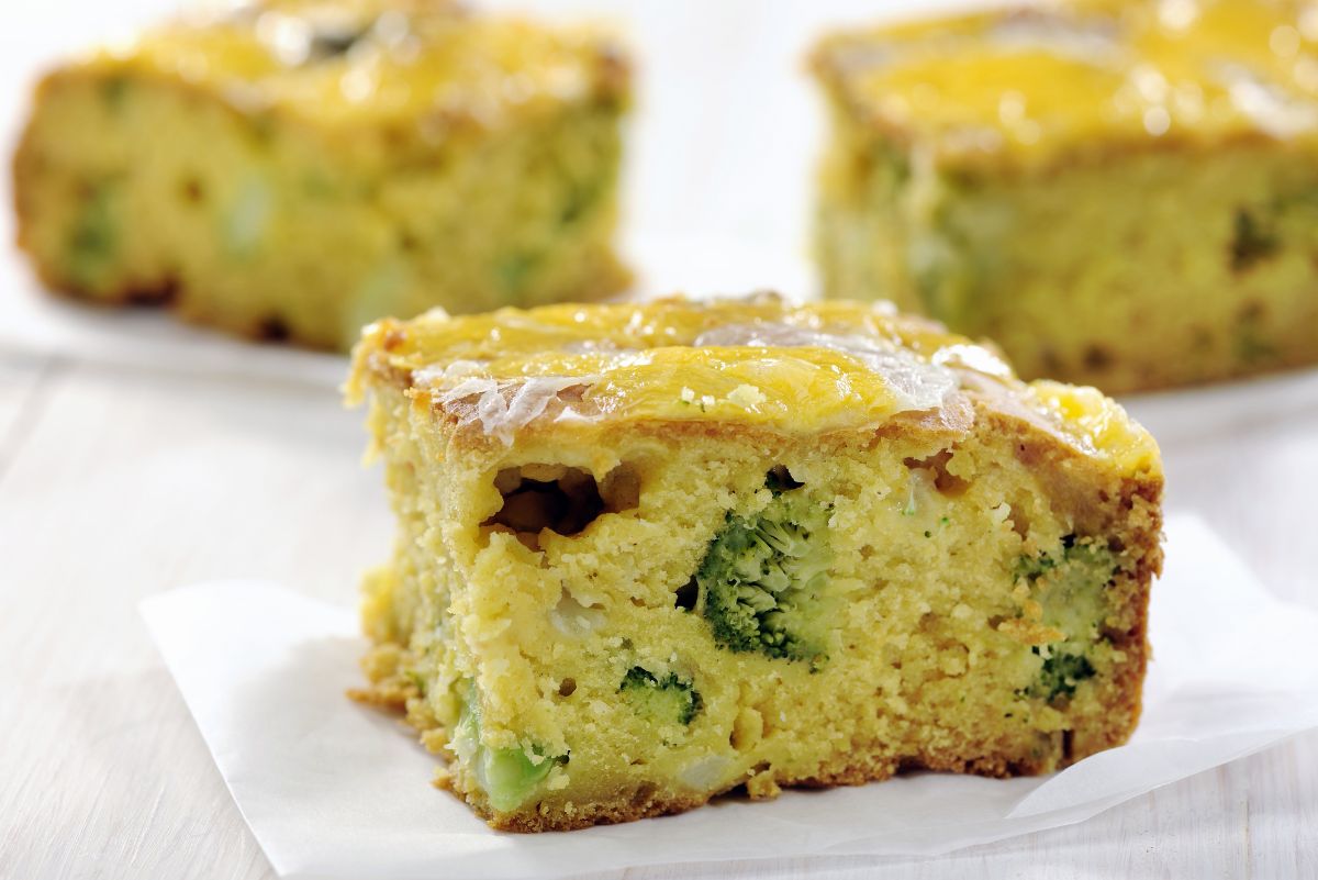 3 pieces of Simple Cheddar and Broccoli Cornbread on a white background.