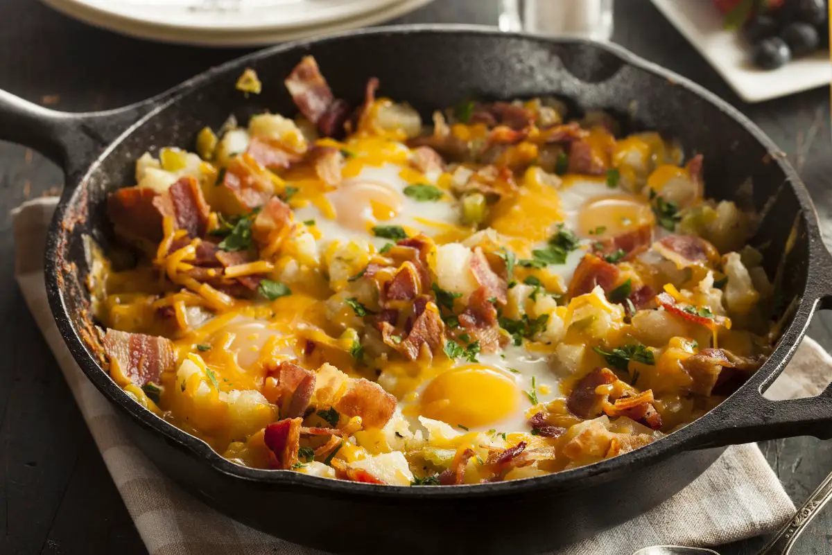 Skillet Breakfast - Egg, Bacon, and Potatoes in a cast iron skillet.