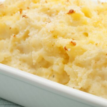 Baked Parmesan Mashed Potatoes in a white baking dish.