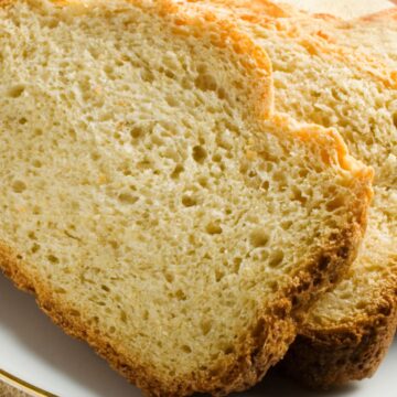 Sliced beer bread on a white plate.