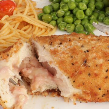 Closeup of Simple Baked Chicken Cordon Bleu on a whtie plate.