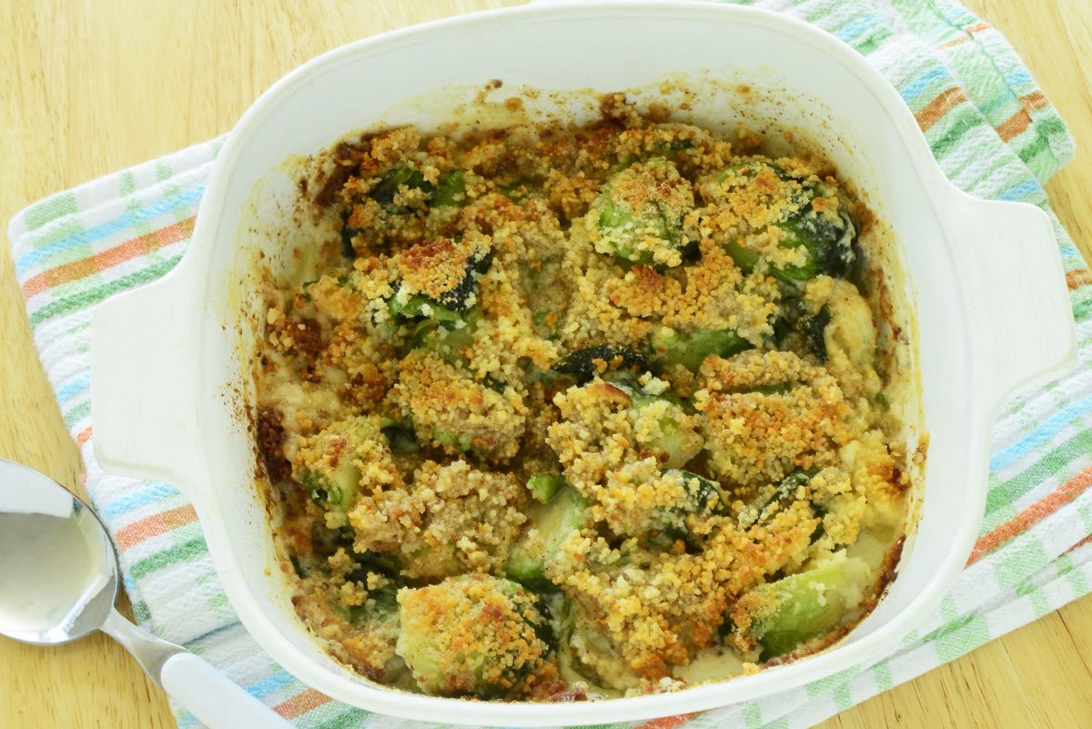 Overhead view of Bacon Parmesan Brussels Sprout Gratin  in a white casserole dish.