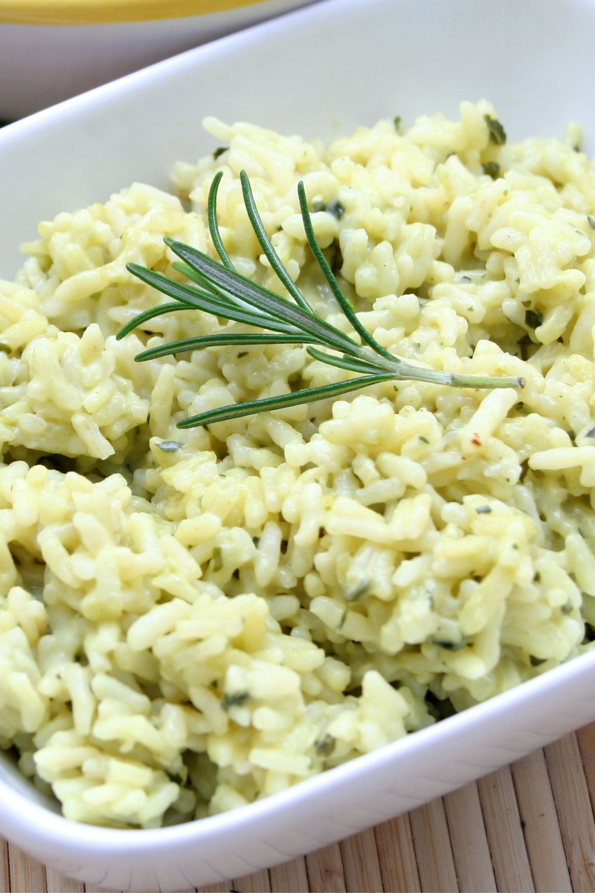 Closeup of Easy Skillet Garlic Rice in a square, white bowl.