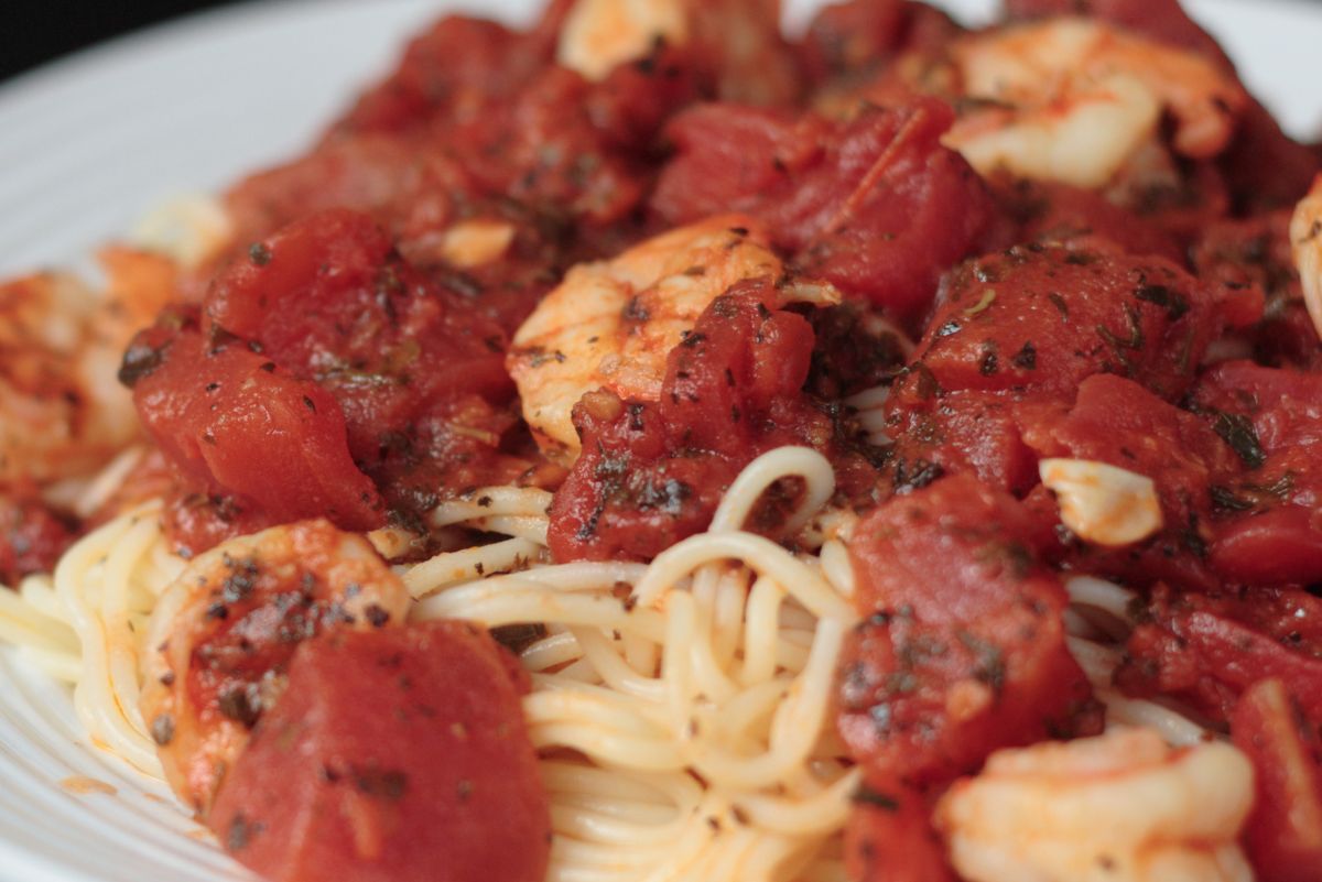 Quick and Easy Shrimp and Basil Pasta on a white plate.