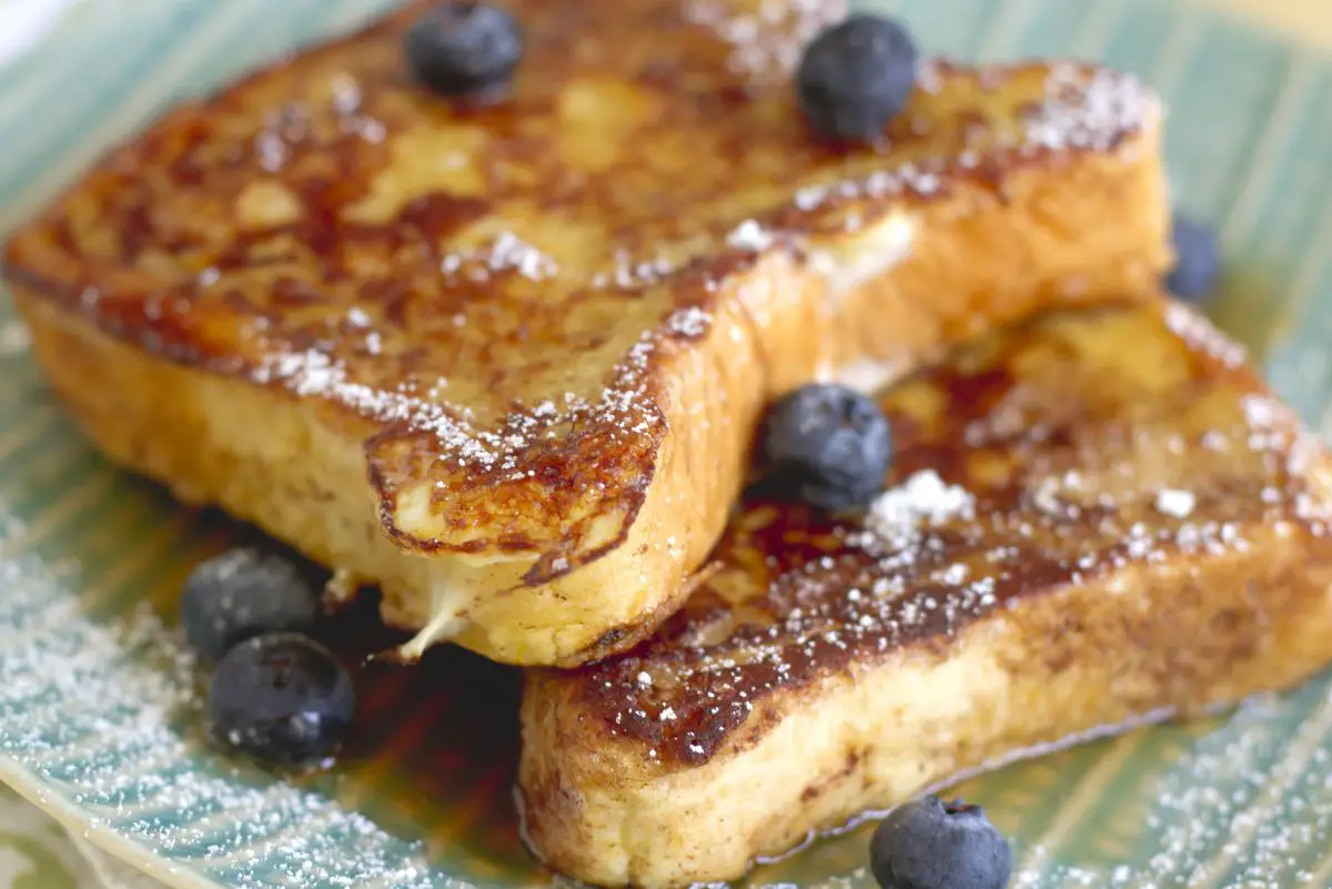 Closeup of Copycat Denny's French Toast on a light blue plate.