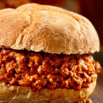 Closeup of Copycat Manwich Sloppy Joe on a dark rustic surface.