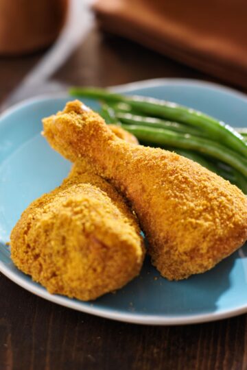 2 Chicken legs coated with Copycat Shake-n-Bake Mix.