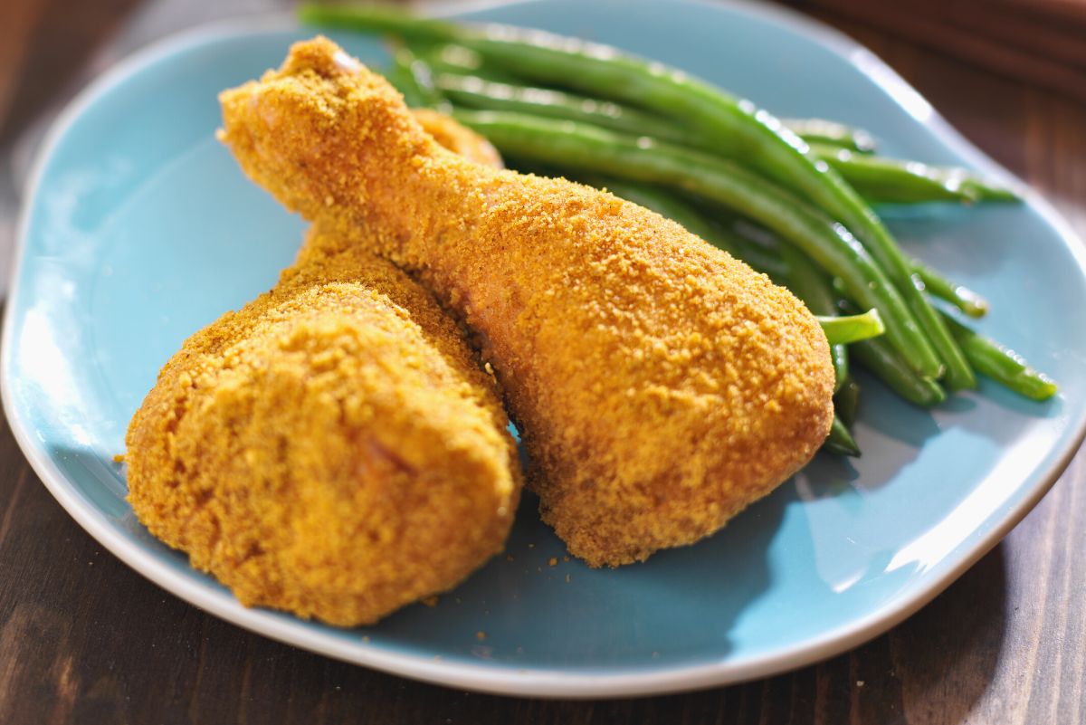 Closeup of 2 chicken legs coated with Copycat Shake-n-Bake Mix.