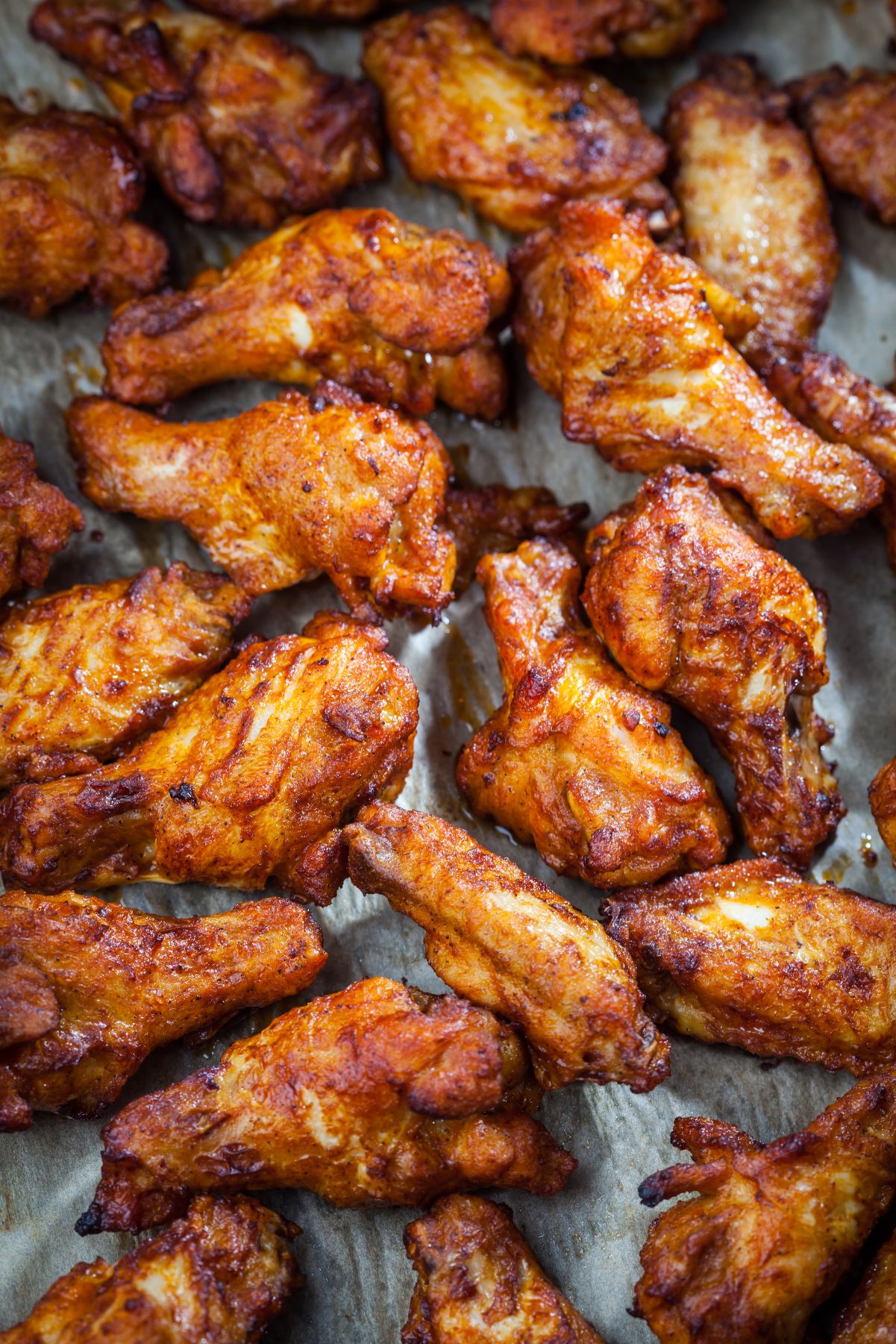 Grilled Asian Honey Chicken Wings on a sheet pan.