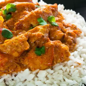 CLoseup of Quick Thai Red Chicken Curry on white rice.