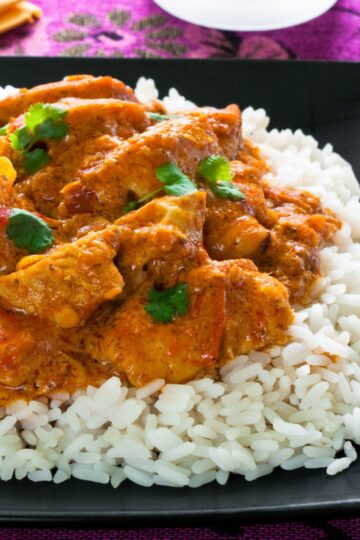 CLoseup of Quick Thai Red Chicken Curry on white rice.