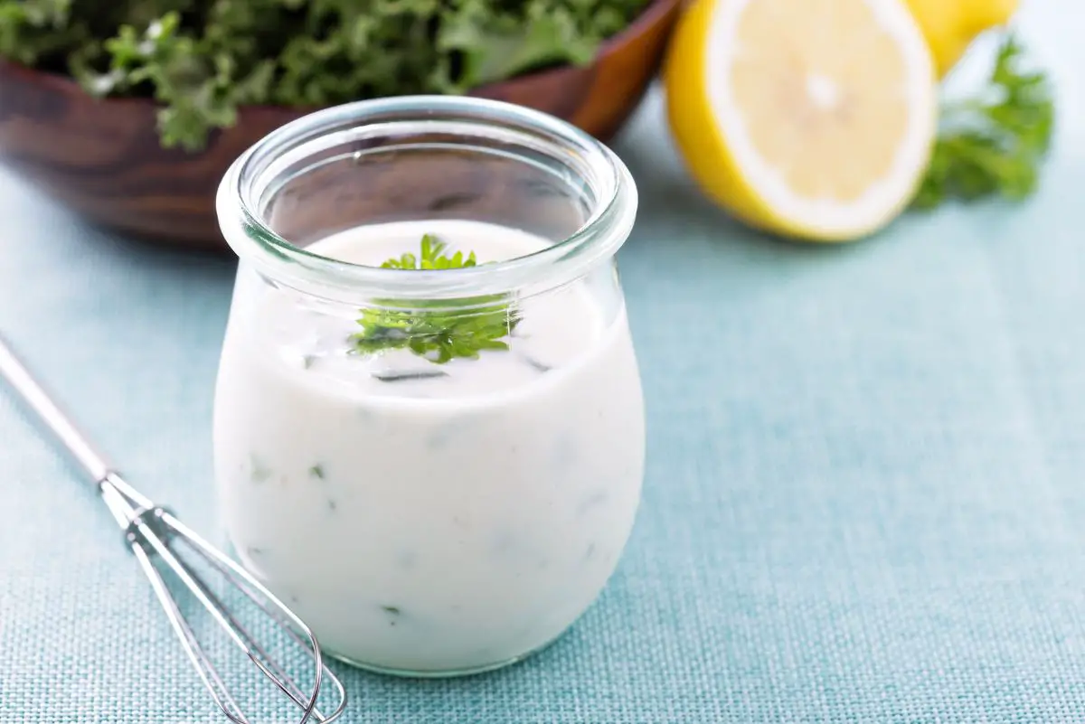 Ranch Dressing (Copycat Outback Steakhouse) in a glass jar on a table.