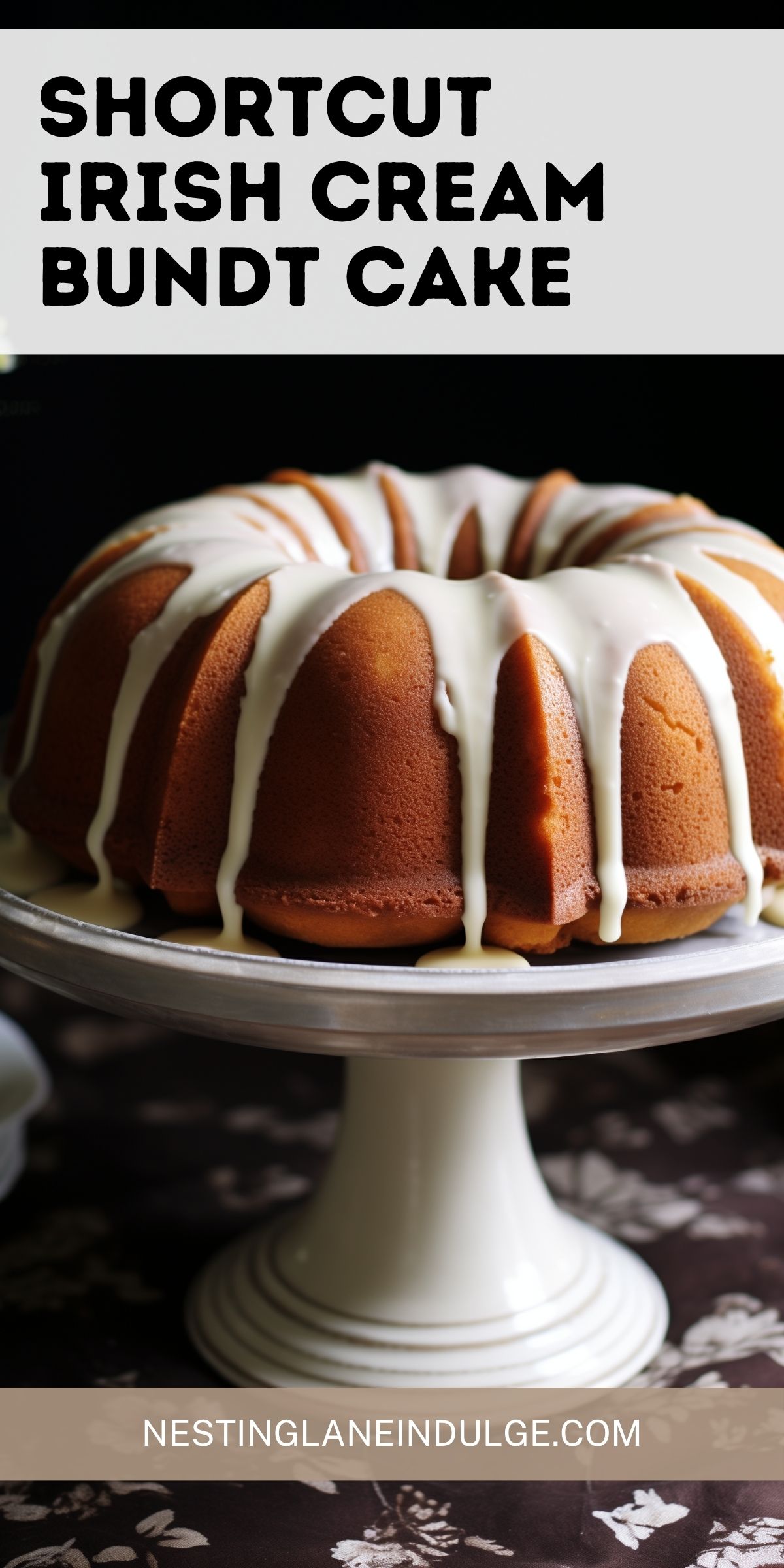A promotional image featuring a Shortcut Irish Cream Bundt Cake on a white cake stand. Above the cake, large black text reads "SHORTCUT IRISH CREAM BUNDT CAKE," and below, the website "NESTINGLANEINDULGE.COM" is displayed. The cake has a white glaze topping over a golden-brown surface and sits elegantly against a dark floral background.