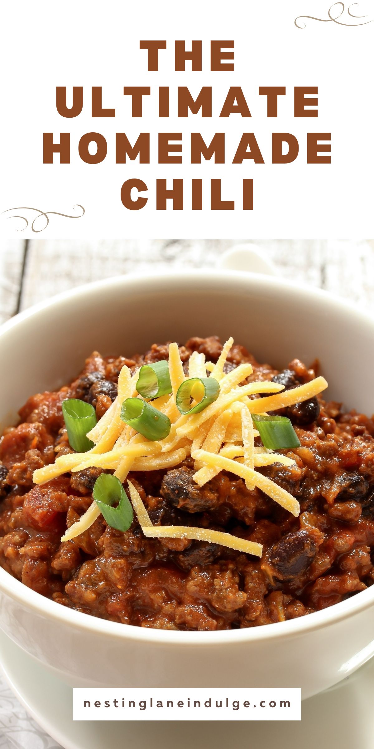 Promotional graphic for The Ultimate Homemade Chili with the title in large, brown font at the top and nestinglaneindulge.com at the bottom. The background is a crisp white with a subtle scroll design at the top and bottom.