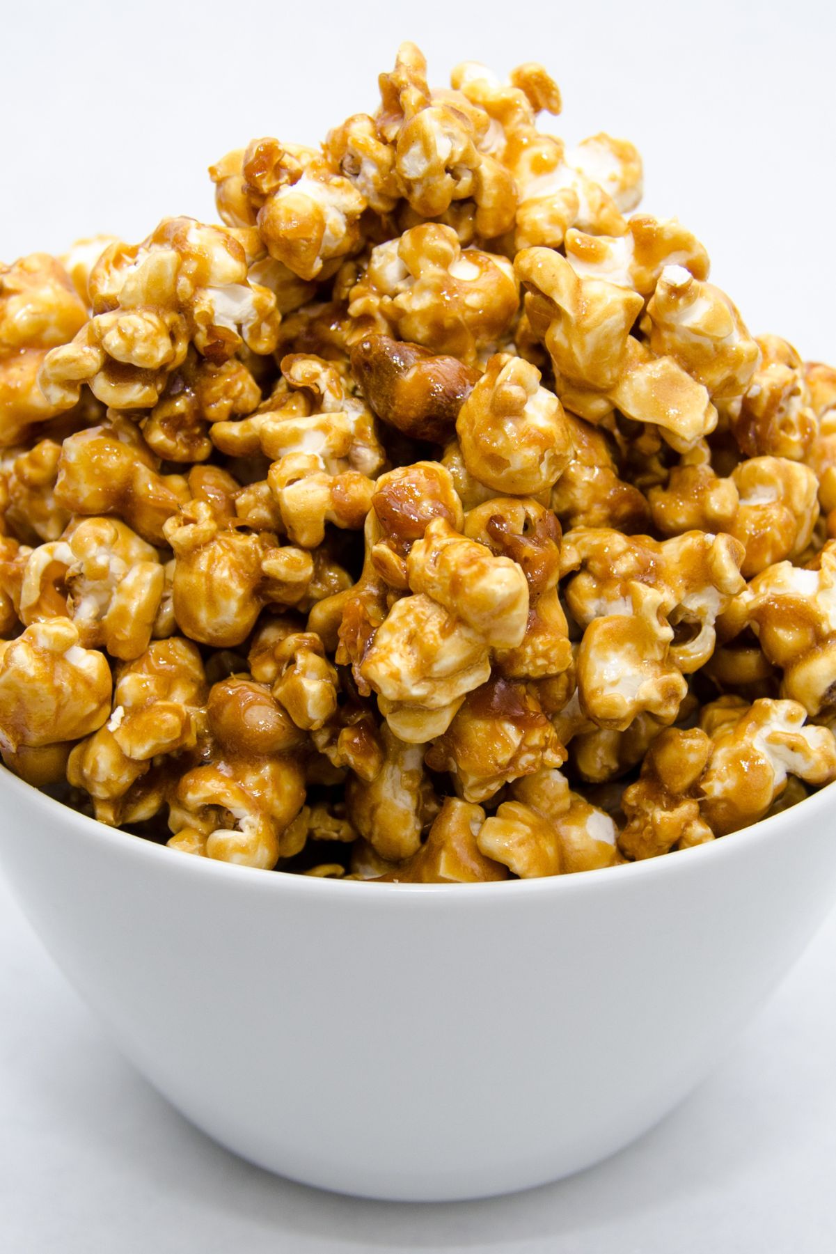 Closeup of Copycat Cracker Jacks in a white bowl.